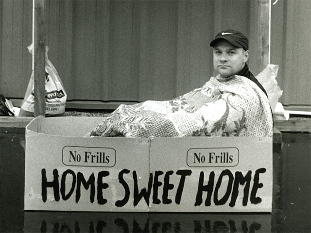 Home sweet home written on cardboard box.
