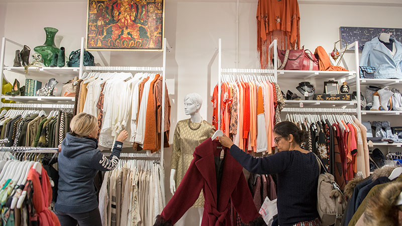 People browse the rails of Shelter's boutique shop