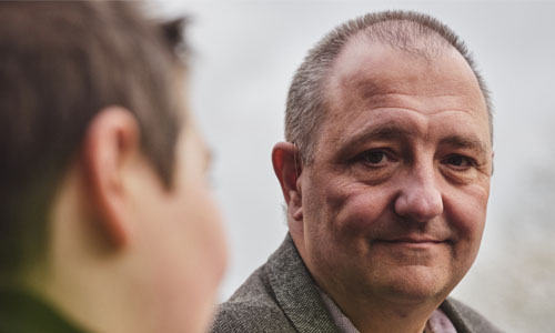 A man called Shandor standing outside.