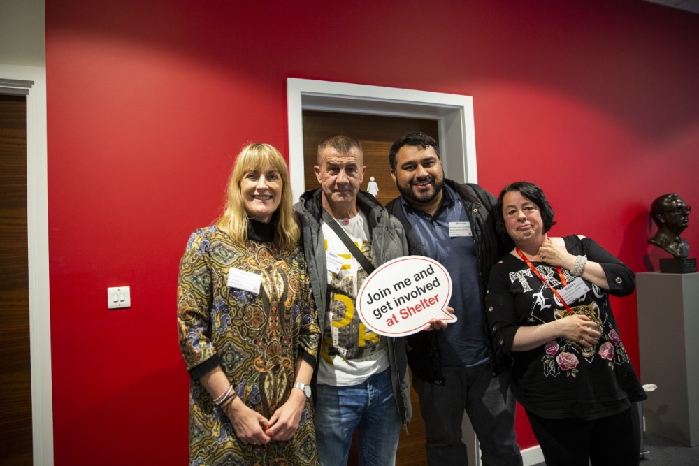 A group of smiling service users at our annual Involvement Conference