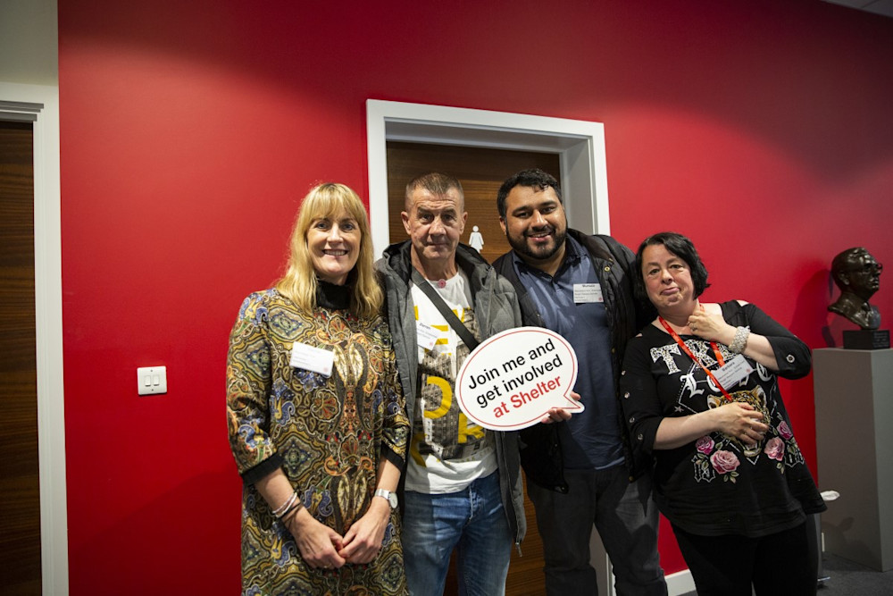A group of smiling service users at our annual Involvement Conference