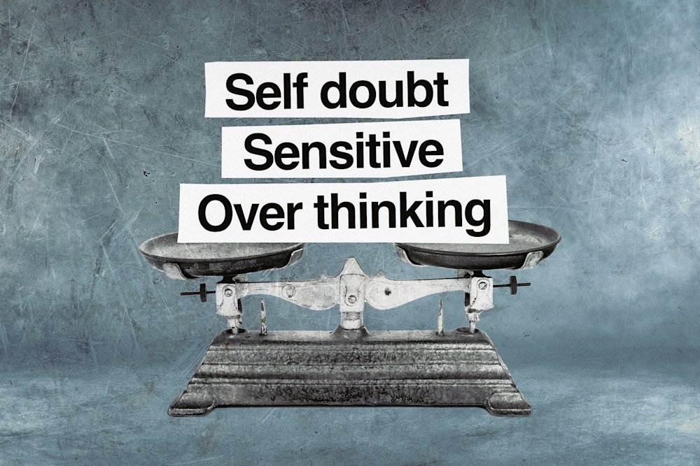 A scale is shown with the word self-doubt, sensitive and overthinking balanced on both plates to signify the range of emotions she went through.