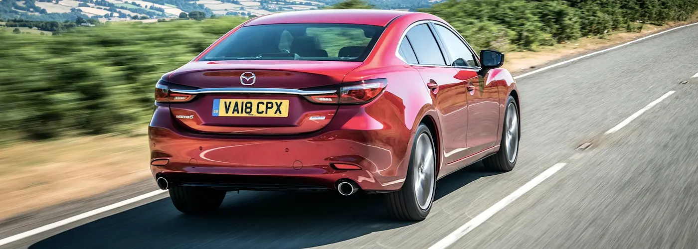 The rear exterior of a red Mazda 6