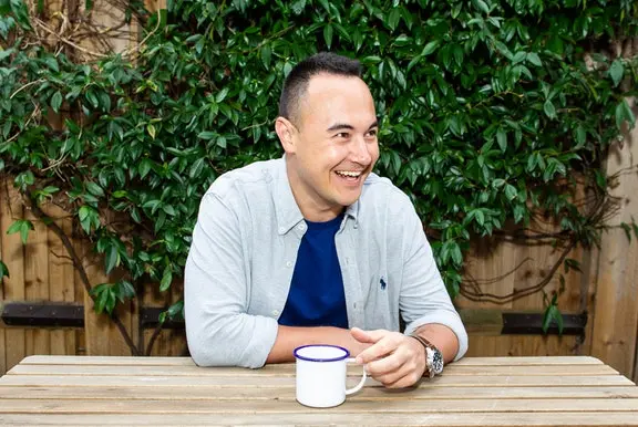 A Cazoo customer smiling after a successful delivery