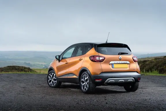 The rear exterior of a yellow Renault Captur
