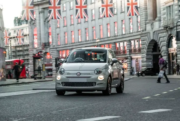The front exterior of a white Fiat 500