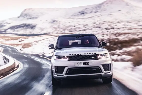 Range Rover driving on a snowy road