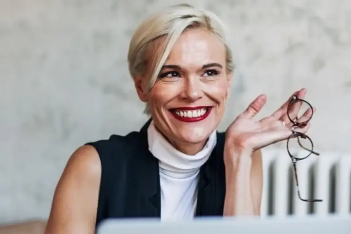 Smiling woman with laptop