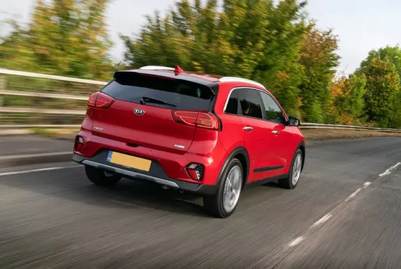 The rear exterior of a red Kia Niro