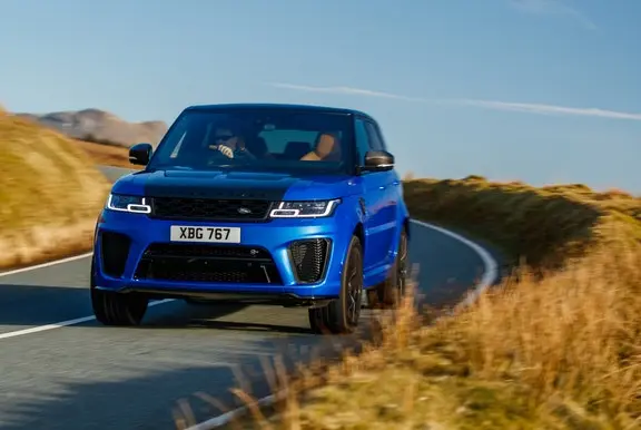 Blue Land Rover driving