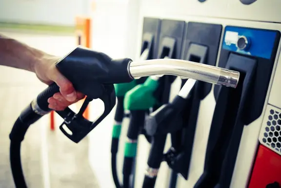 Someone picking up a fuel pump