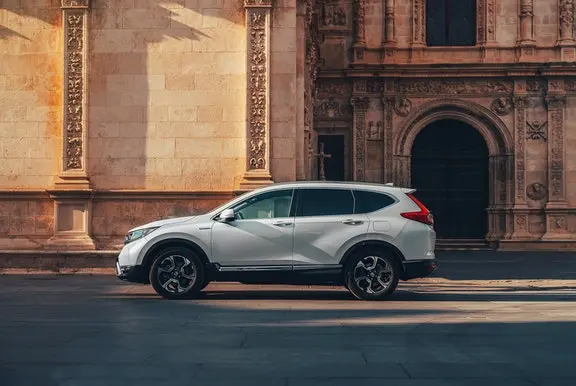 The side exterior of a white Honda CR-V