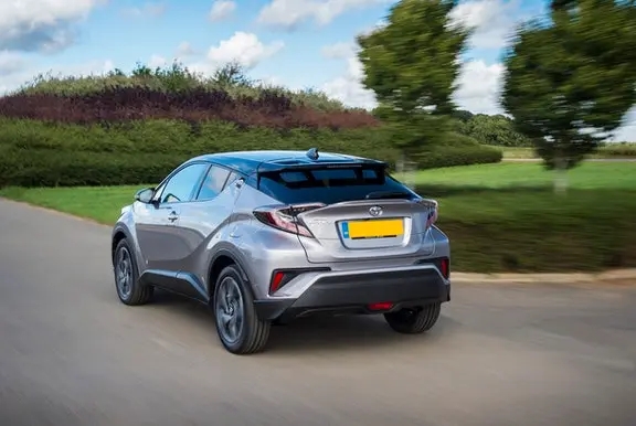 The rear exterior of a silverToyota C-HR