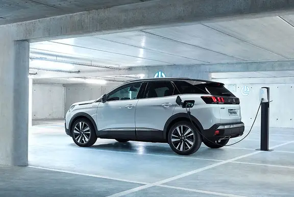 The side exterior of a white Peugeot 3008
