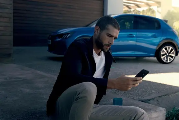 Peugeot 208 man on phone