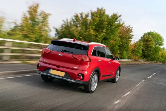 The rear exterior of a red Kia Niro