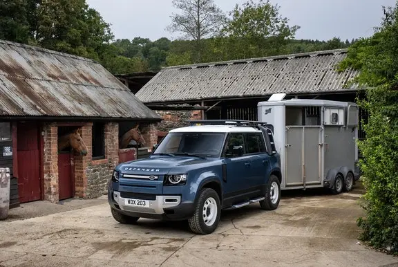 Land Rover Defender towing a horse box