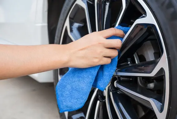 A car wheel being cleaned