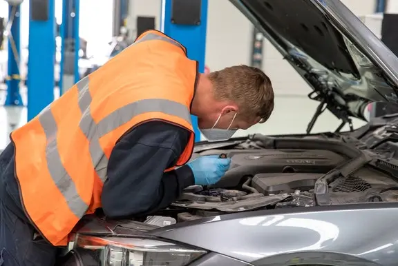 Man inspecting a Cazoo car
