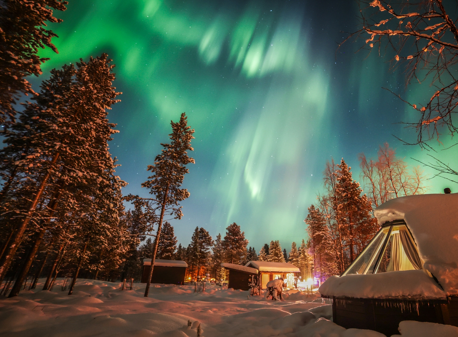 12 Web Finland winter ivalo igloo with northern lights by Lari Laasjarvi