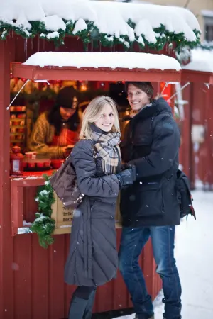 Couple at Christmas Market, Stockholm Old Town. Credit: Visit Stockholm, Henrik T