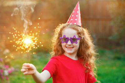 Girl holding sparkler