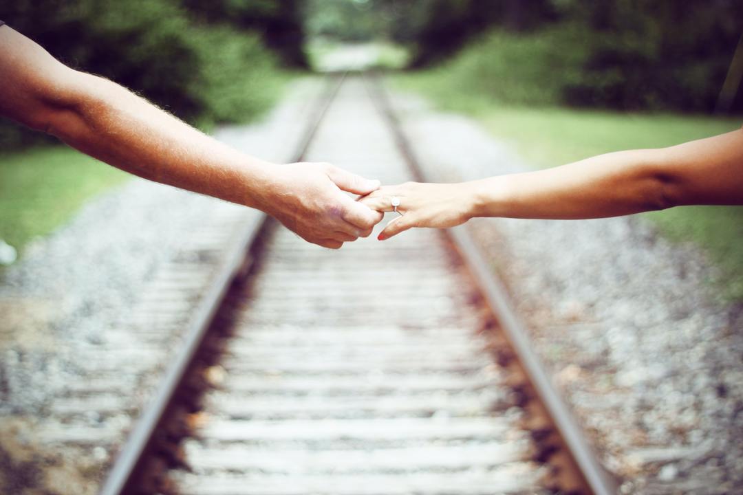 Traditional Wedding Vows for the Timeless Couple - couple on train rails