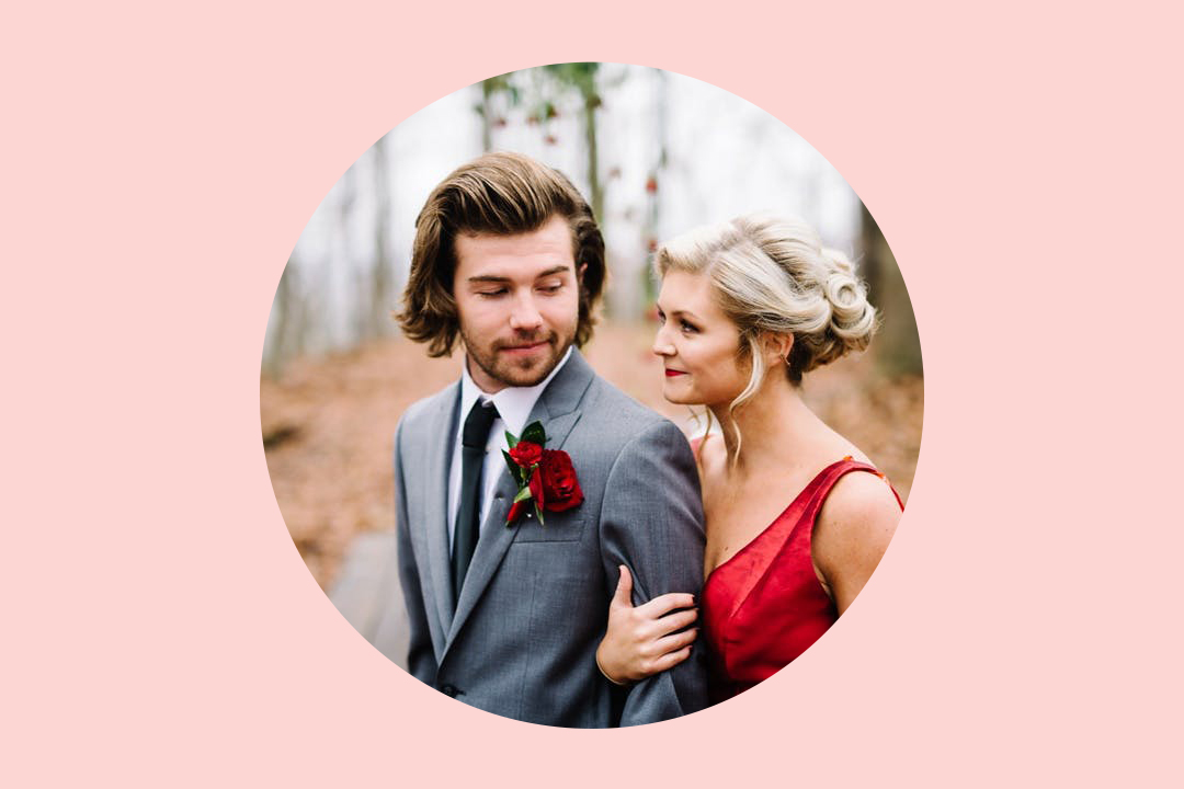 Couple in circle image with pink background. She wears a red dress and he wears a gray suit.