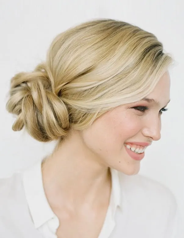 Bun with side-swept bangs updo