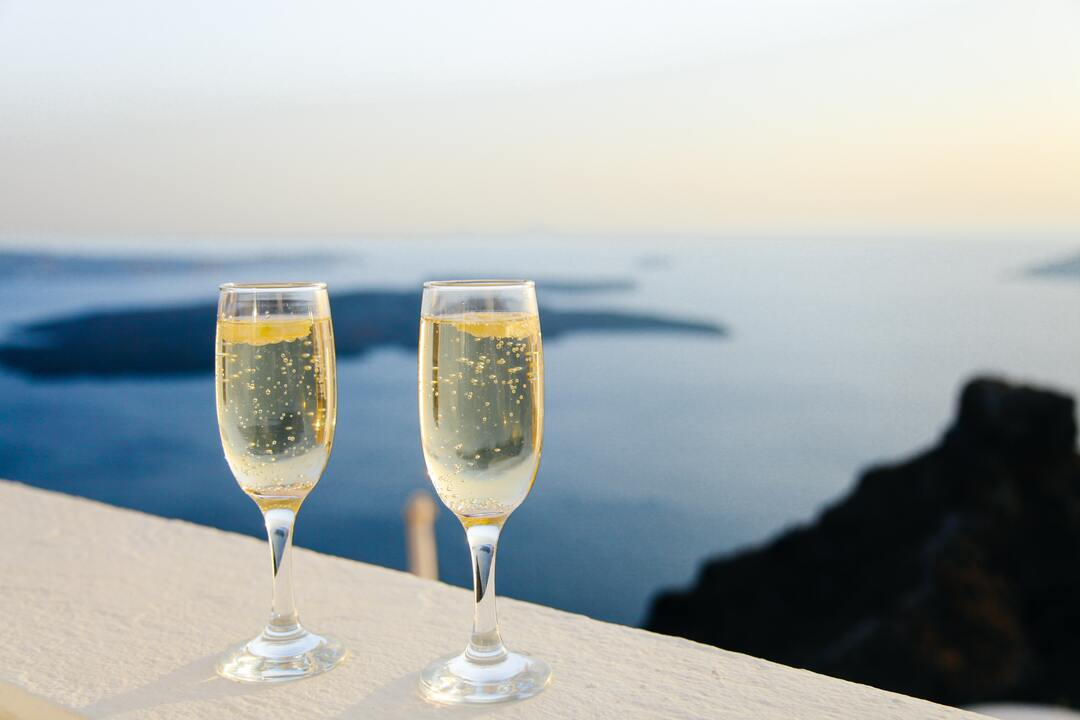 Champaign glasses overlooking a scenic ocean view