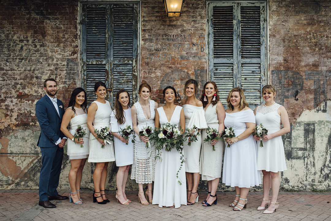 bride with bridesmaids in mismatched dresses