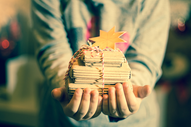 Girl Holding Gift Books