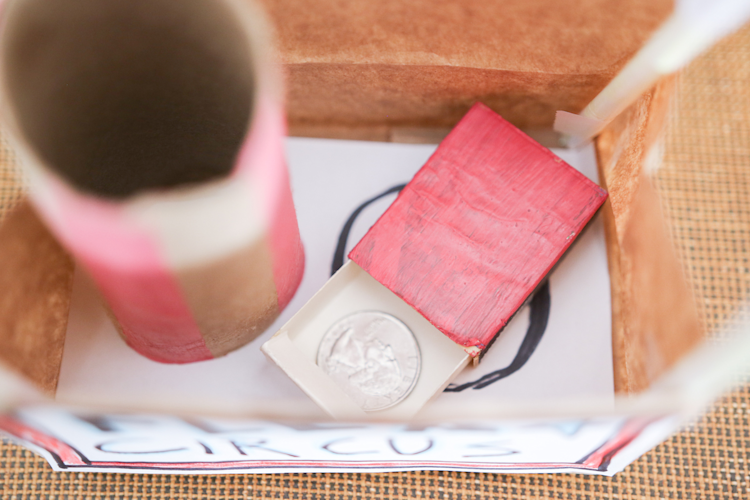 Place Matchbox Inside Paper Bag Next to Tube