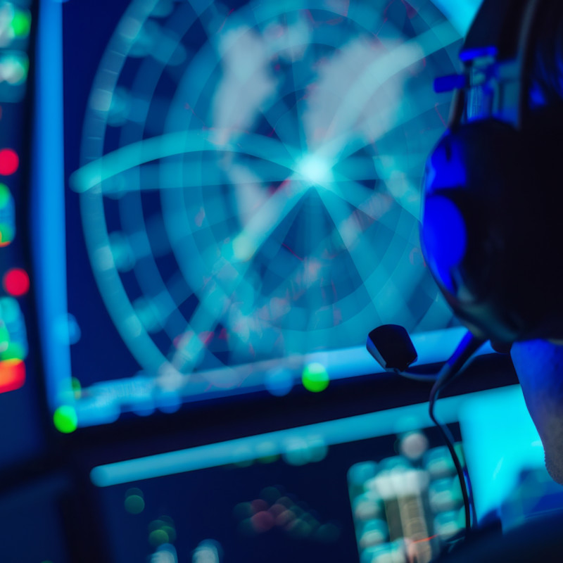 A man working at a digital console.