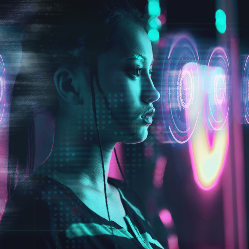 AI concept of a woman standing with round coloured circles reflected in front of her face.
