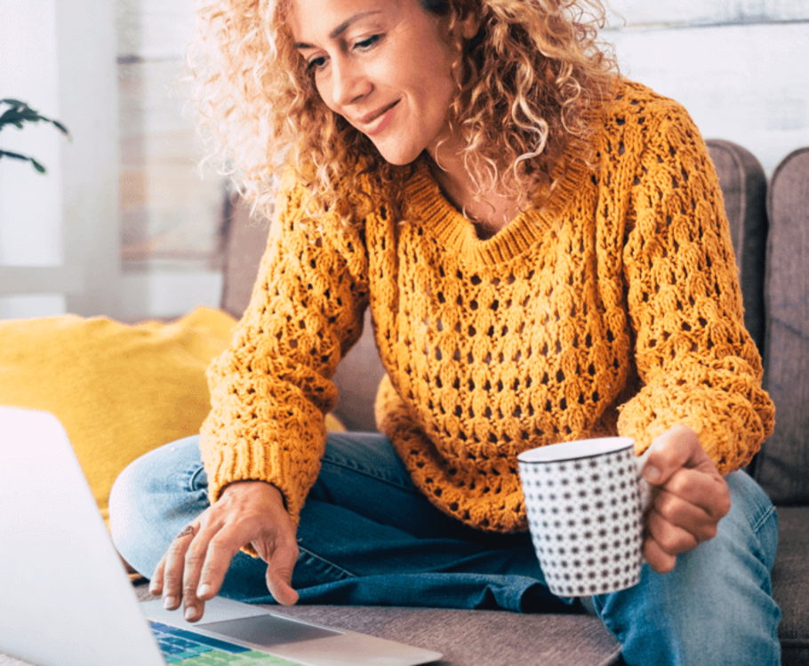 Woman in living room using a laptop