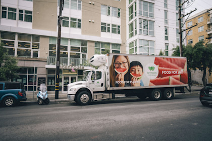 SF-Marin Food Bank truck delivering groceries in front of Openhouse