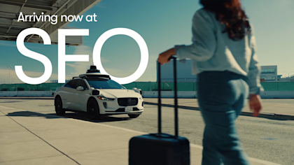 Waymo vehicle picking up a traveler at SFO airport