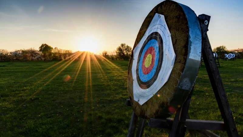 An image of an archery target in the sunset. 