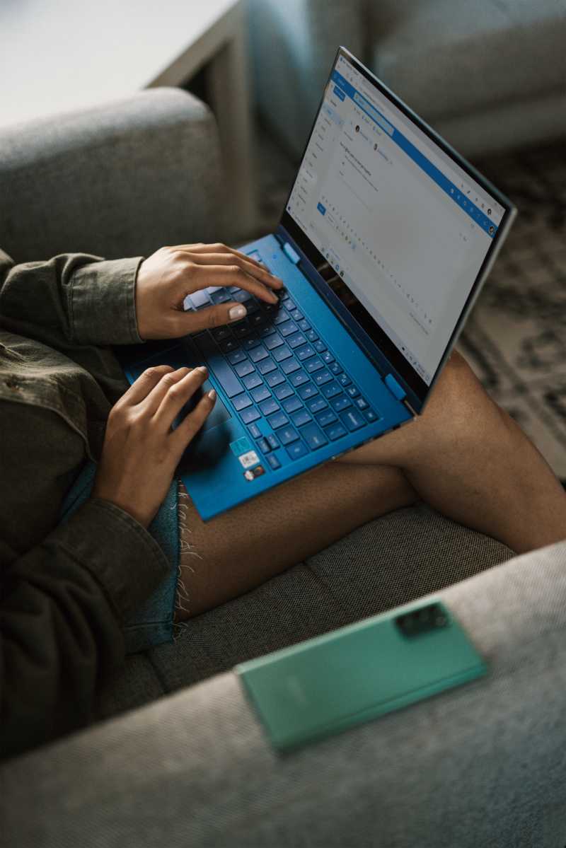 An image of a person on a laptop