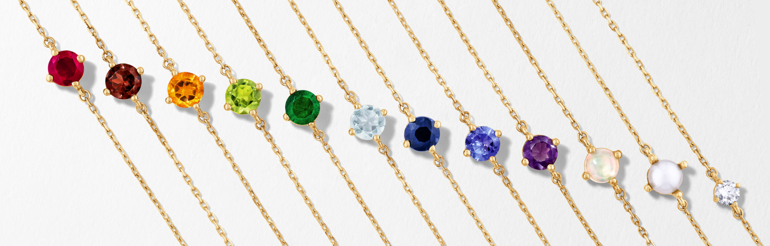 birthstone bracelets featuring gemstone for each month in gold