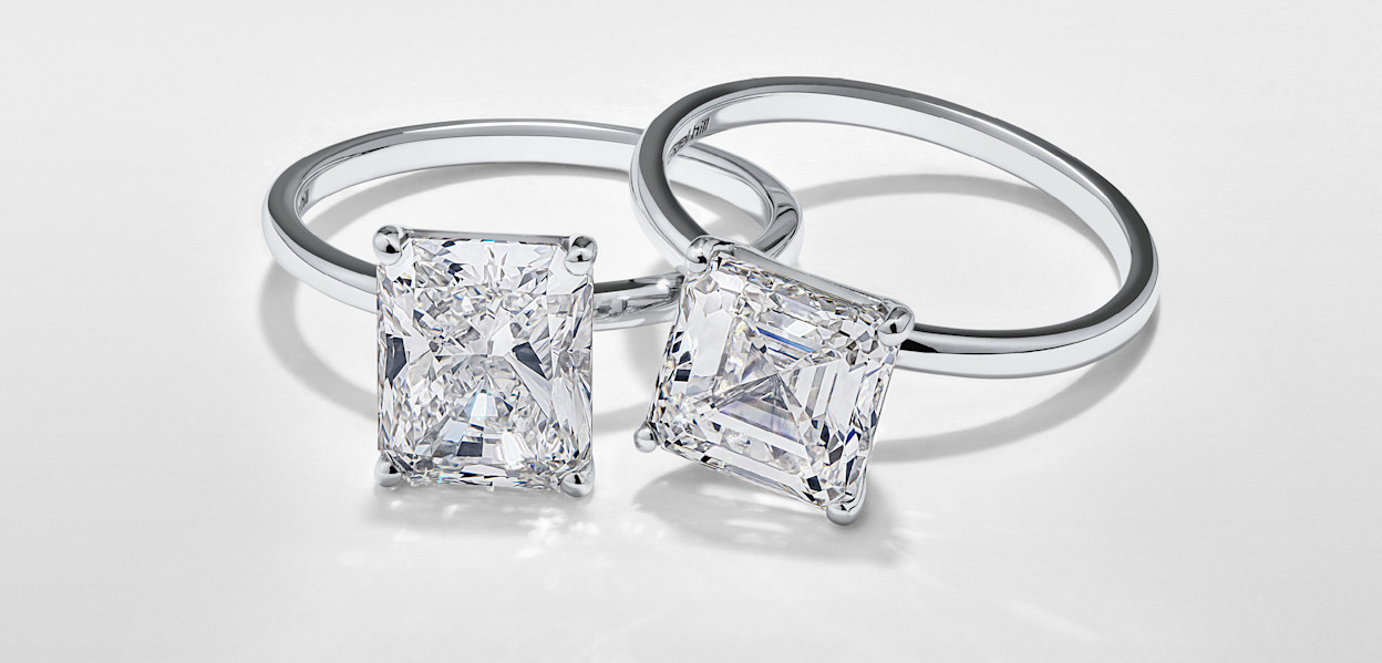 two engagement rings with large diamonds