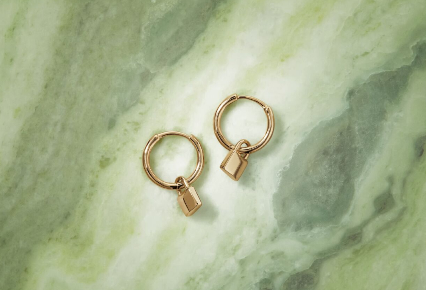 yellow gold signature lock hoop earrings