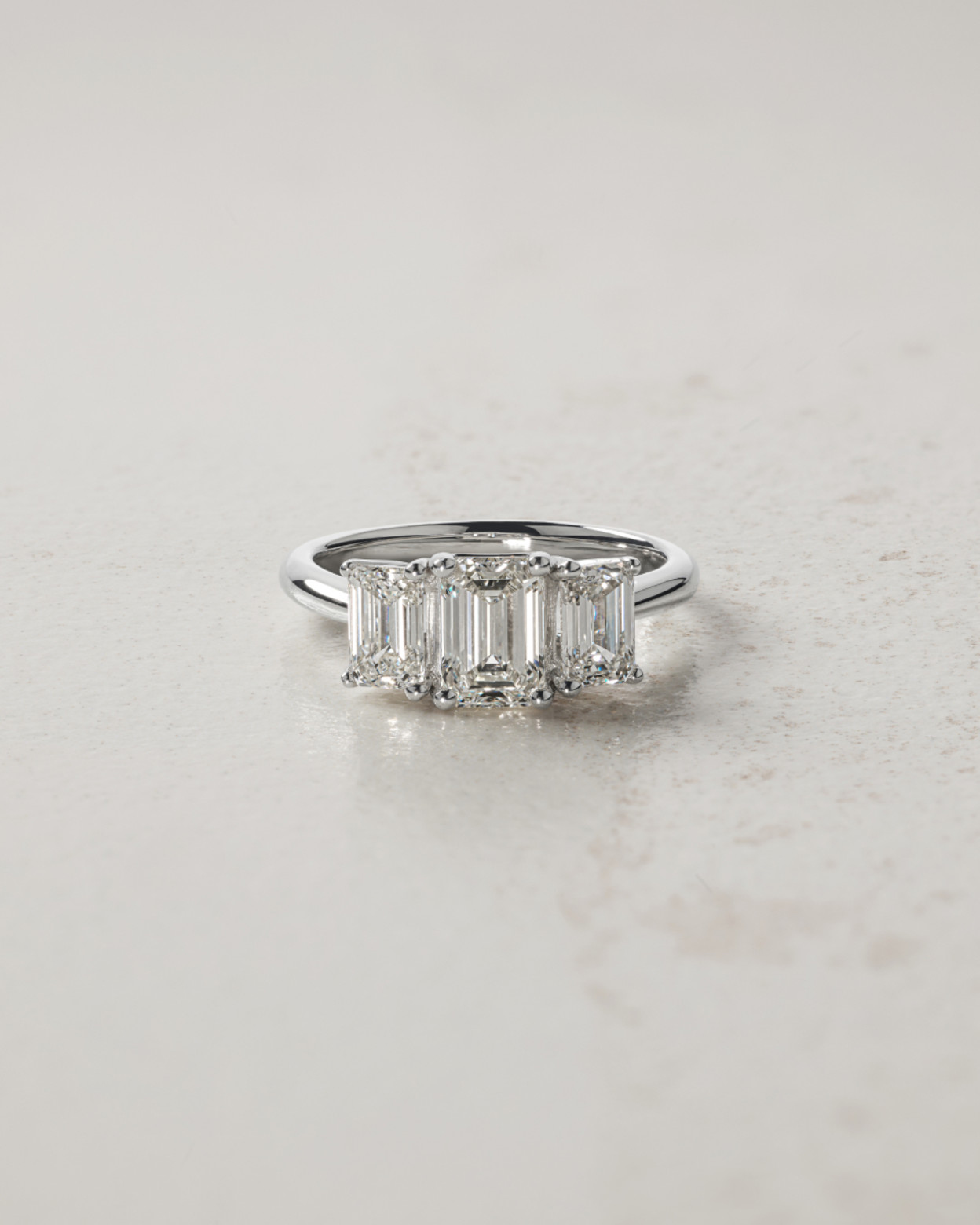 Flatlay of 3 stone engagement ring