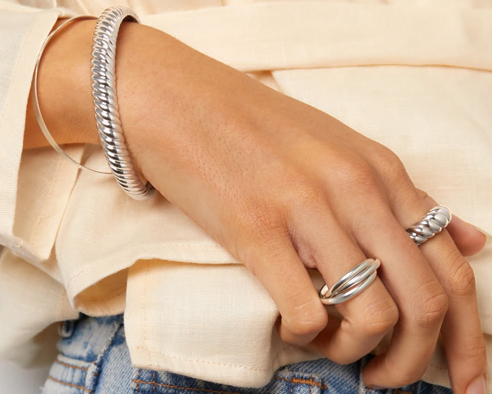 styled silver jewellery rings and bracelets
