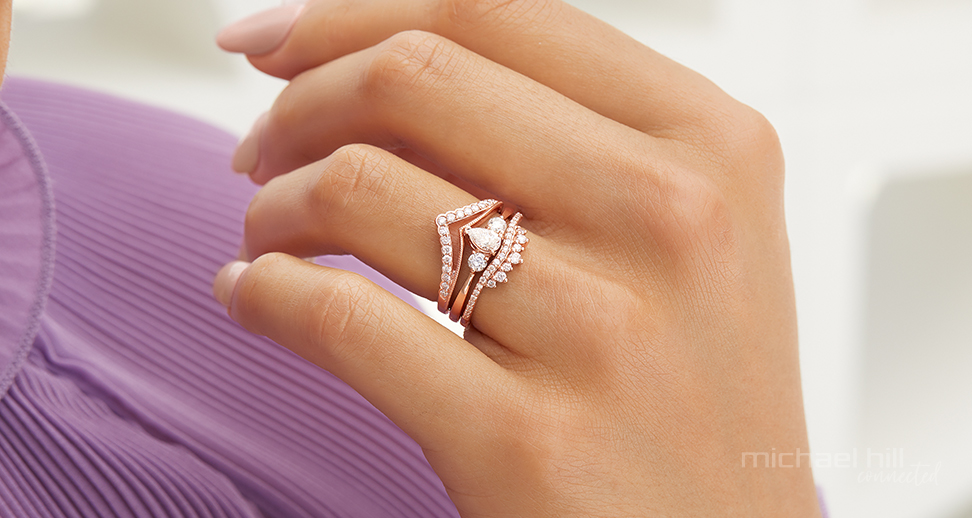 Woman wearing rose gold bridal ring set