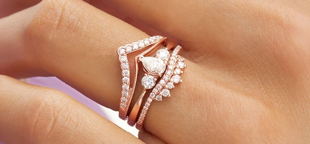 Woman wearing rose gold bridal ring set