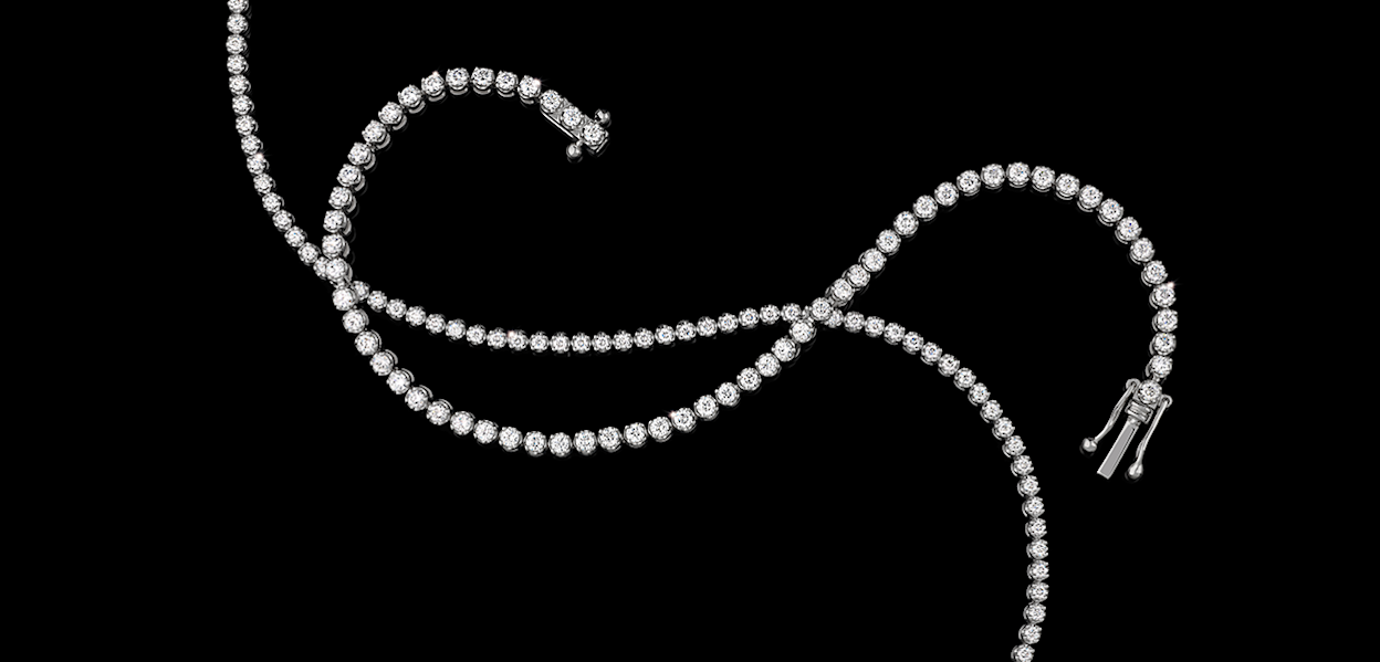 two tennis bracelets on black background
