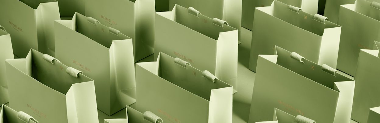 Several Michael Hill green onyx bags in rows