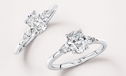 oval and pear cut three stone engagement rings in white gold 